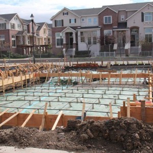 Can Am plumbing lays out pipes for multi dwelling residence